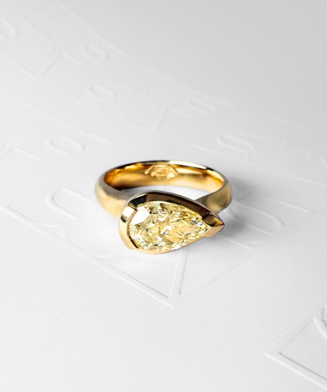 Suspense Pear Shape Fancy Light Yellow Diamond Ring, 18ct Yellow Gold