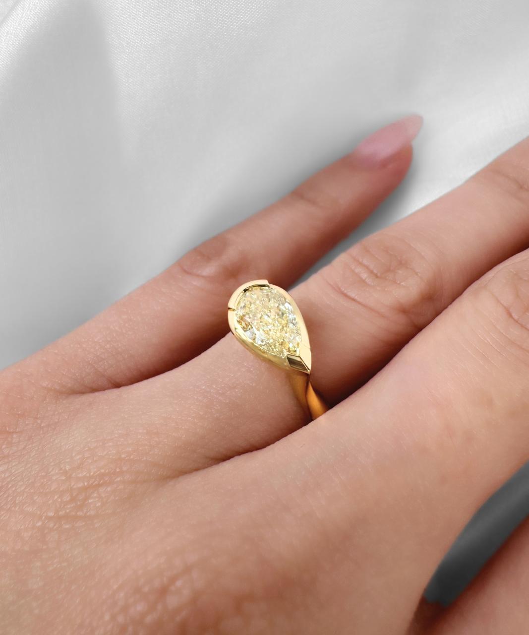 Suspense Pear Shape Fancy Light Yellow Diamond Ring, 18ct Yellow Gold